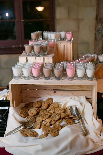 a simple cookie bar with a crate, fresh cookies placed on fabric and some milk in glasses