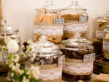 rustic styling with large jars, burlap and lace for each type of cookie is a cool idea for a rustic wedding