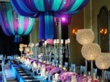 large colorful tulle spheres hanging over the reception tables for formal weddings
