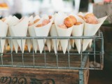 a wire stand with paper cones filled iwht mini donuts will make your guests happy at night