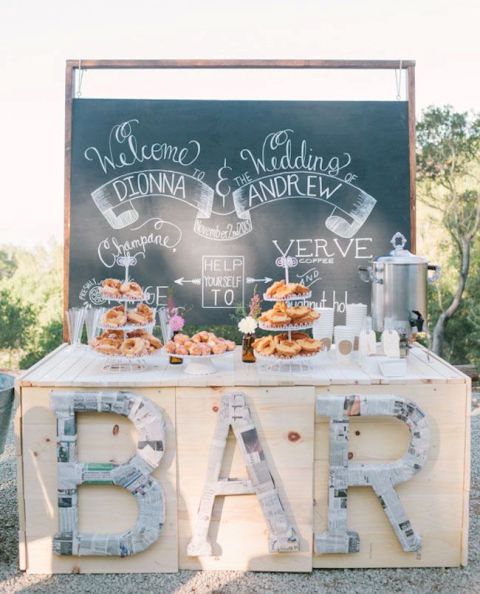 a relaxed rustic donut bar with donuts on stands, coffee and tea for a comfy and cozy wedding