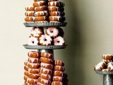 a super tall metal display for donuts and tons of them are ideal for a rustic wedding