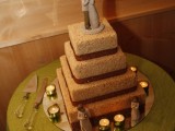a square krispie rice wedding cake with chocolate decor and romantic sugar toppers