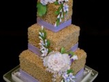 a square krispie wedding cake with lilac ribbons and lots of sugar blooms and greenery is a cool idea for spring