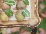 pear leaves as escort cards are a creative and cool idea for a fall wedding, they can double as favors
