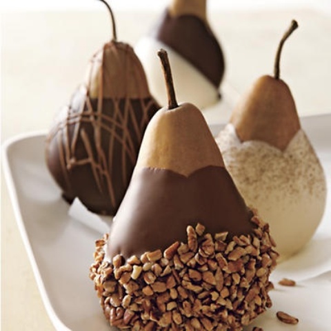 candied and chocolate dipped pears with nuts and other stuff are delicious and decadent wedding desserts that can be also offered as favors