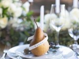 a pear wrapped with a name is a creative idea of a wedding seating card, and can double as a favor, great for a fall wedding