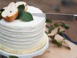 a white textural buttercream wedding cake topped with foliage and pears is a lovely idea for a fall wedding