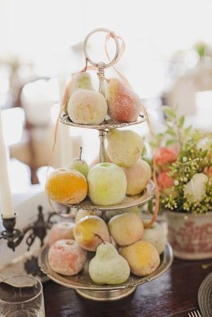 a stand with sugared fruit is a healthy alternative to usual wedding sweets, enjoy fresh fruit with delicious taste