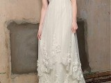 a strapless empire waist A-line wedding dress with a draped bodice, lace edges and a train is very sexy