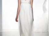 a fitting wedding dress with an embellished bodice, an empire waist, pleated skirt and spaghetti straps