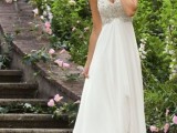 a strapless empire waist wedding dress with an embellished bodice, a layered skirt looks chic and elegant