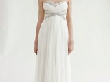 an exquisite strapless empire waist wedding dress with a draped bodice, a pleated skirt and embellishments
