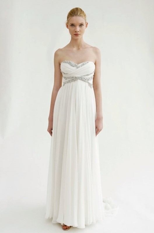 an exquisite strapless empire waist wedding dress with a draped bodice, a pleated skirt and embellishments