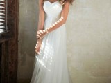a strapless A-line empire waist wedding dress with a draped bodice and pleated skirt with a train is simple and chic
