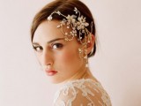 a sleek low updo with an outstanding embellished hairpiece on one side for a gorgeous and unforgettable look