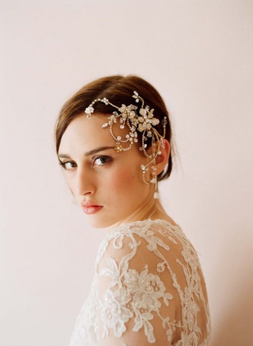 a sleek low updo with an outstanding embellished hairpiece on one side for a gorgeous and unforgettable look