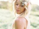 a delicate floral crown accenting loose waves for a free-spirited and airy bridal look, no veil required