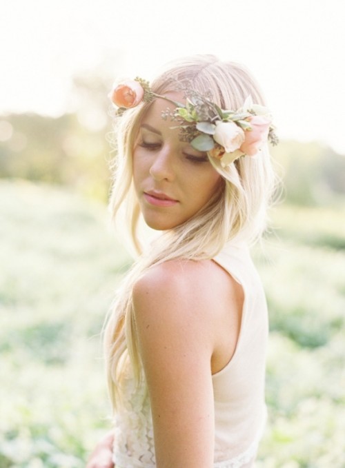 a delicate floral crown accenting loose waves for a free-spirited and airy bridal look, no veil required