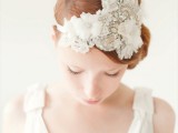 an embellished and white fabric flower headpiece will make your bridal look refined and vintage and will add chic to the outfit