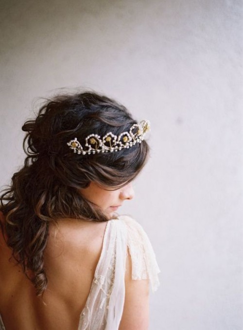 loose wavy half updo accented with a beautiful pearl and gold rhinestone tiara for a refined and effortlessly chic look