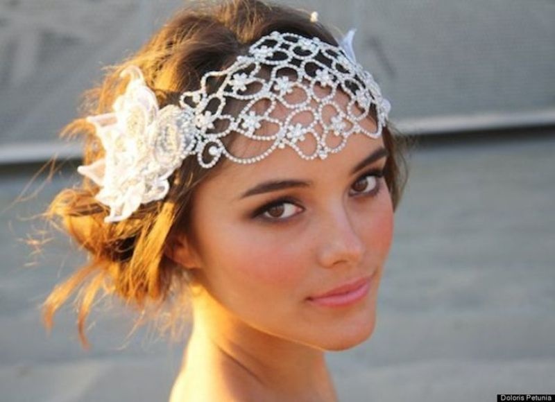 A dreamy embellished boho wedding headpiece with white fabric blooms is a gorgeous idea for a boho wedding