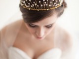 a low updo with an embellished wedding tiara are a perfect idea for a modern refined bridal look with a royal touch