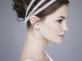 a Greek-styled updo with curls and lace ribbon wrapping it is a chic solution for a Greek-inspired or destination wedding