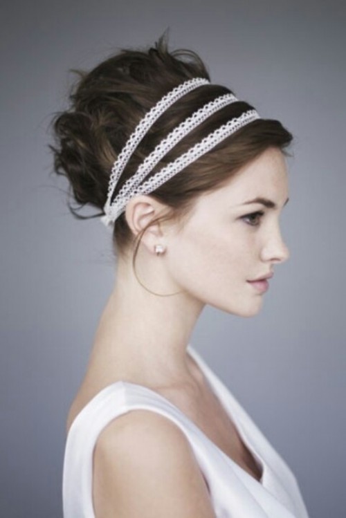 a Greek-styled updo with curls and lace ribbon wrapping it is a chic solution for a Greek-inspired or destination wedding