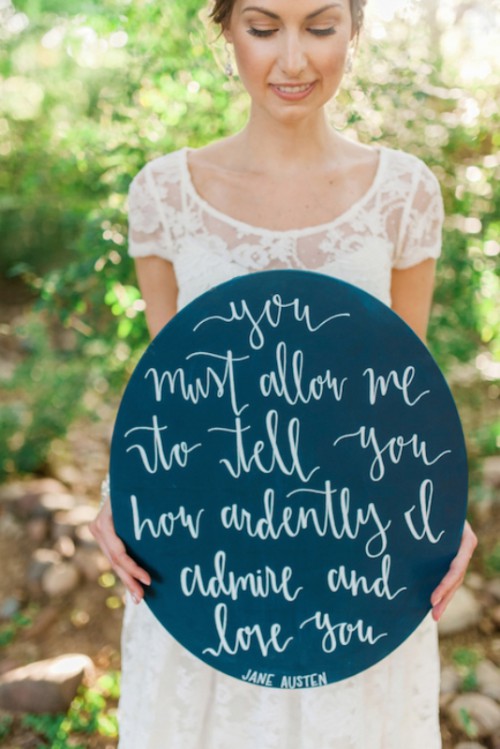 a round chalkboard sign with white calligraphy is a cool decor idea for any wedding that isn't too formal