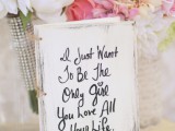 a wedding guest book accented with the couple’s favorite quote is a cool and chic idea for any modern wedding