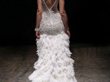 a glam 1920s inspired wedding dress with embellishments, a feather skirt with a train and a cutout back