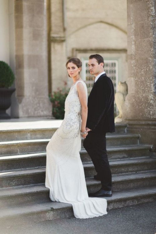 a romantic sleeveless fully embellished wedding dress with a train is a chic idea for a Great Gatsby wedding