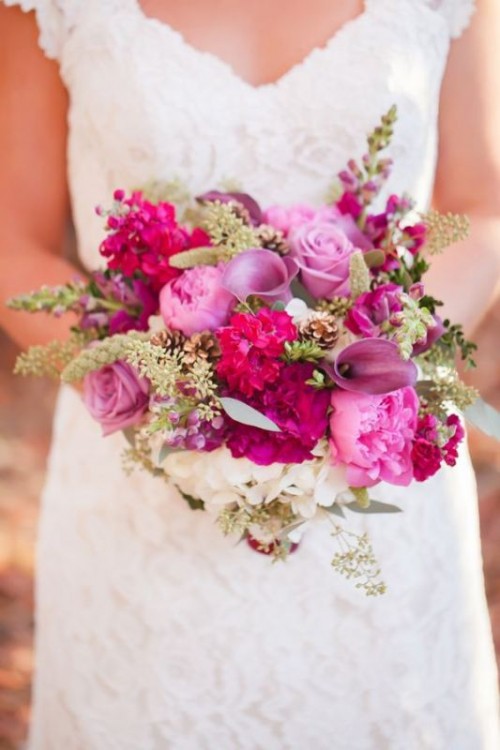 a fuchsia, light pink and lilac wedding bouquet with roses, peonies, callas, greenery is a cool idea for a bright wedding