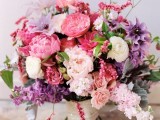 a pink and lilac wedding bouquet with neutral, blush, lilac, pink  blooms, greenery and a neutral wrap is a chic idea for a spring or summer wedding