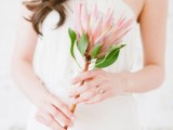 a simple king protea wedding bouquet