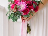 a pink and fuchsia wedding bouquet with roses, peony and greenery and pink ribbon is a lovely idea for a summer celebration