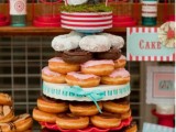 a stand with glazed donuts isn’t only a budget-friendly but also a trendy idea today – who needs a cake when we can have donuts