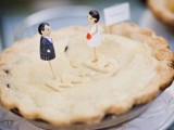 a simple homemade pie with cute toppers is a cozy alternative to a usual wedding cake