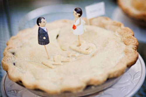 a simple homemade pie with cute toppers is a cozy alternative to a usual wedding cake