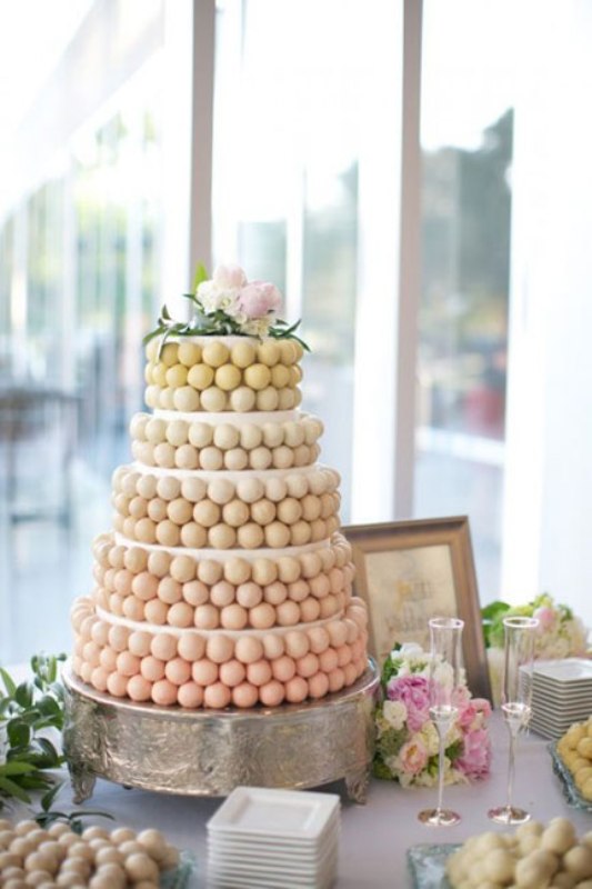 An ombre wedding cake of cake pops is a fresh and unusual alternative to a usual wedding cake