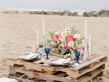 a pallet table may be placed on the beach for your wedding picnic, it’s a simple idea