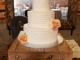 a pallet cake stand with handwriting is a stylish idea for a rustic wedding