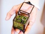 a framed glass box filled with moss is a pretty idea for a garden or woodland wedding