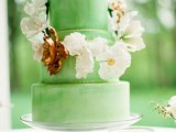a green wedding cake with neutral blooms is a lovely idea for a spring or summer wedding with botanical touches