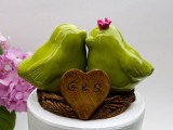 little green love birds like these ones can be used as wedding cake toppers or just as wedding decor
