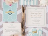 an aqua blue and white wedding invitation suite, with stripes and an octopus is fun and chic