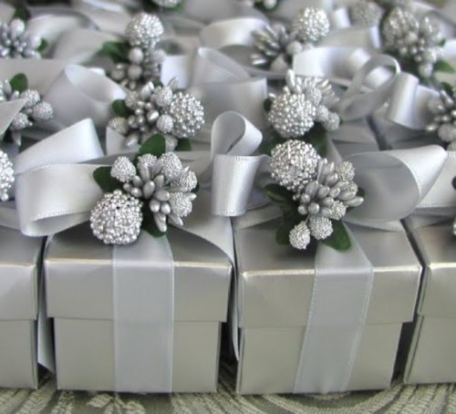 grey boxes with silver ribbons, berries and pinecones for winter wedding favors, pure elegance and glam