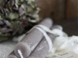 grey candles, tall and thin ones, will be nice for decorating your wedding tablescape