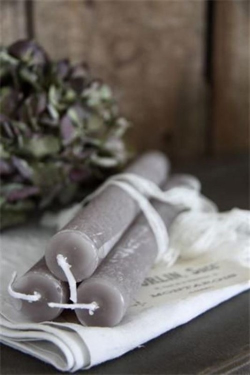 grey candles, tall and thin ones, will be nice for decorating your wedding tablescape